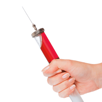 Hand holding a syringe with a red handle