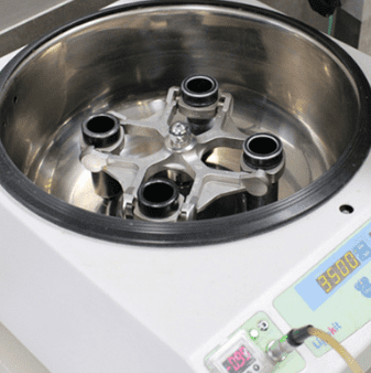 Close-up of a centrifuge machine in use